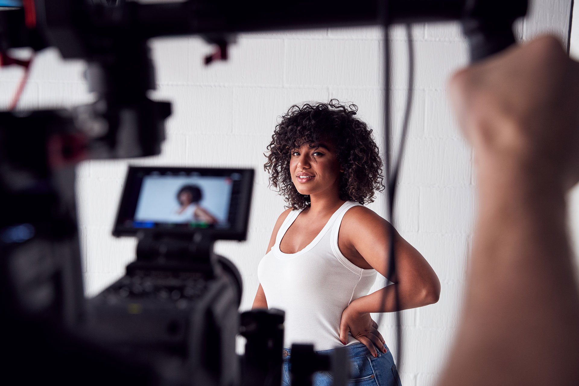 female-model-posing-for-video-camera-on-film-set-2021-08-26-16-14-45-utc