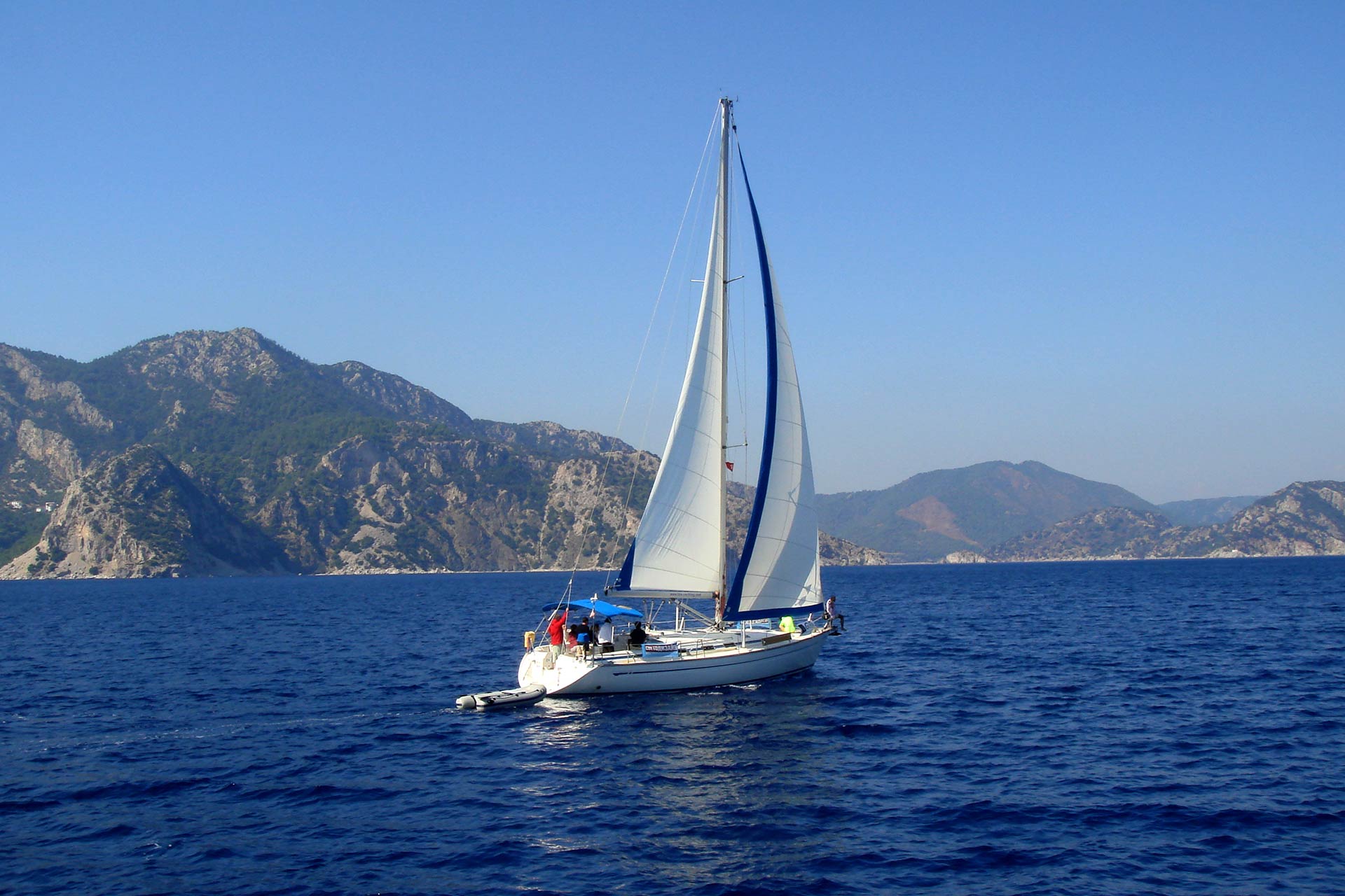 yacht-with-white-sail-sailing-on-a-calm-sea-on-a-b-2022-05-11-22-46-02-utc